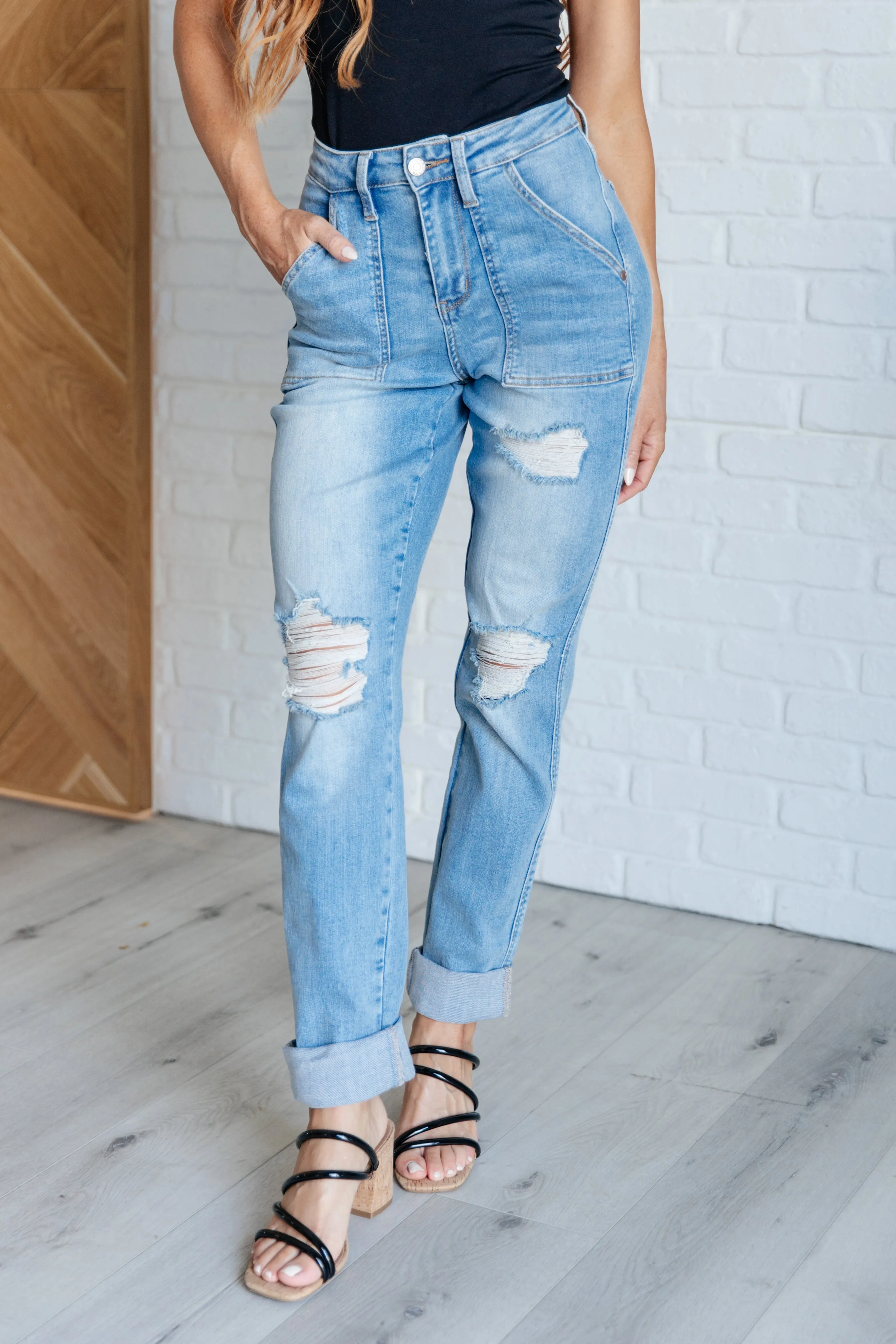 Aiden distressed boyfriend jeans with high rise and patch pockets.