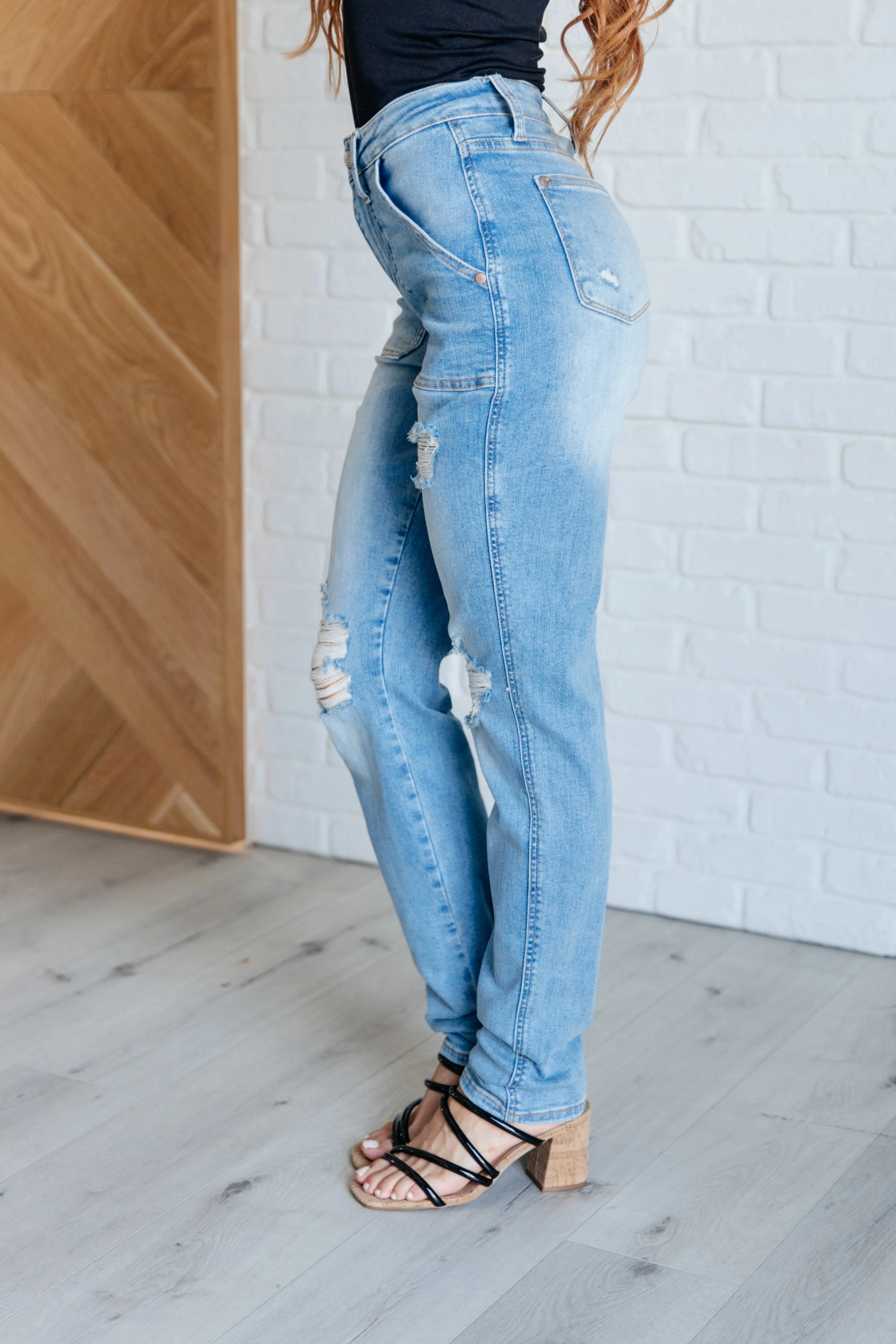 Aiden distressed boyfriend jeans with high rise and patch pockets.