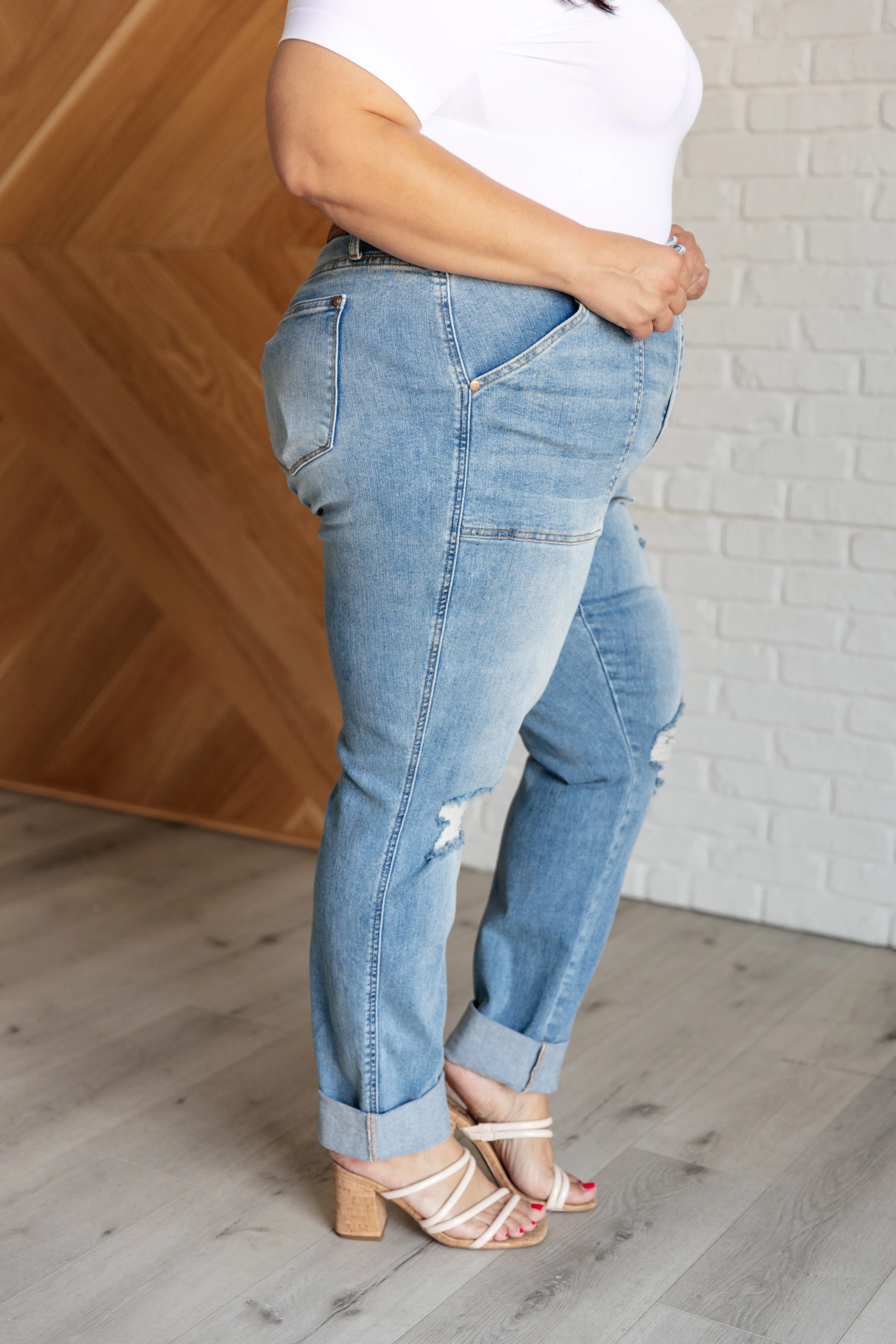 Aiden distressed boyfriend jeans with high rise and patch pockets.