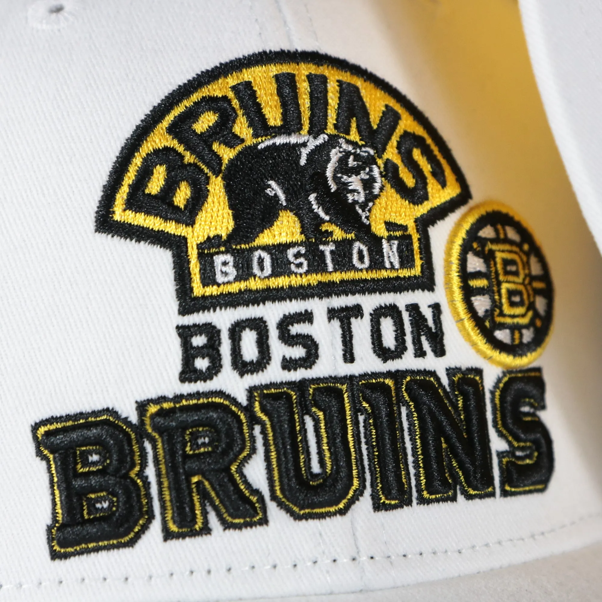 Boston Bruins Snapback Hat White Yellow Bottom.