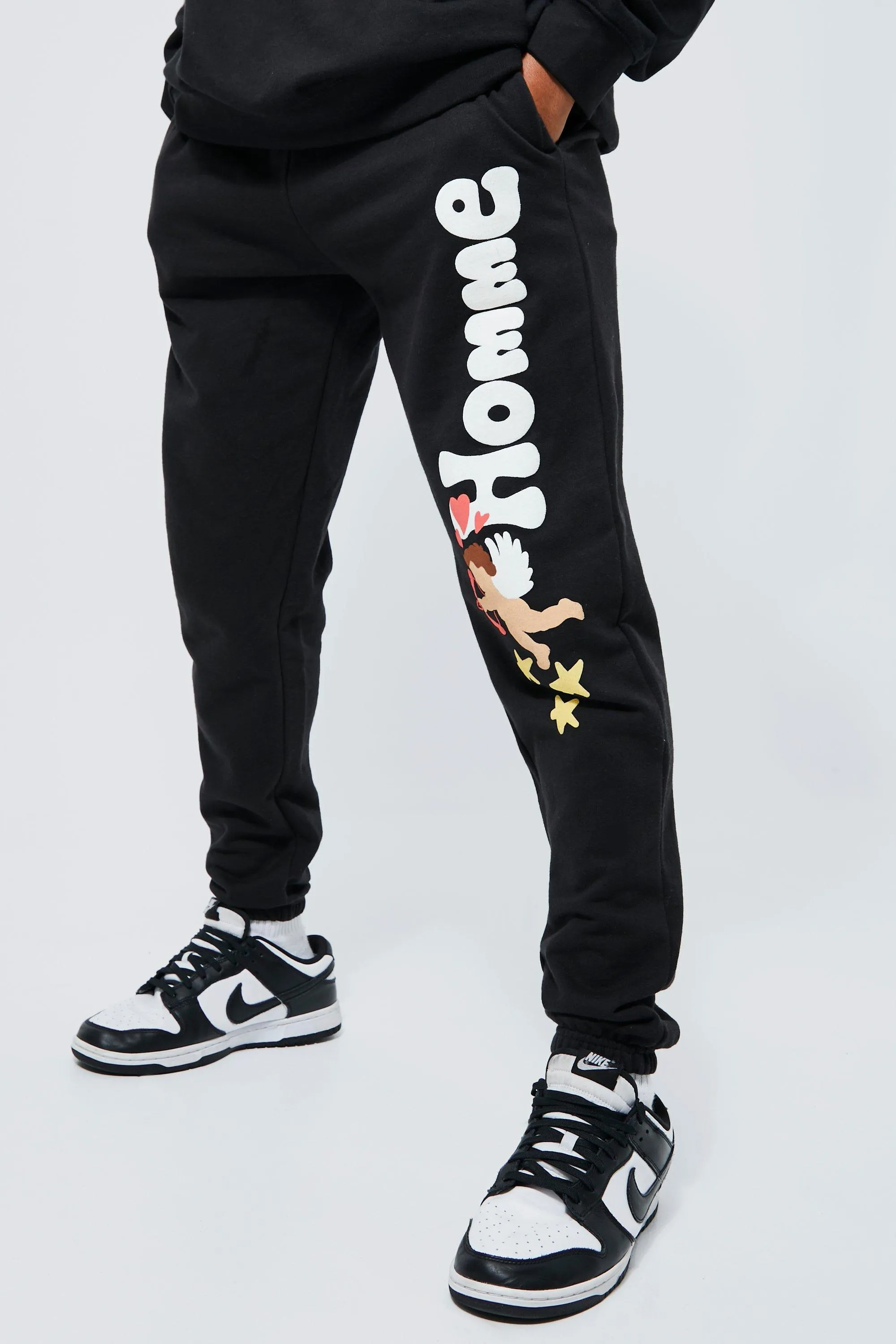 Regular Fit Cherub Graphic Joggers | boohooMAN UK